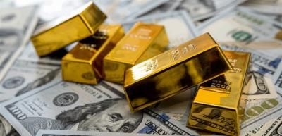 الذهب يتراجع متأثراً بارتفاع الدولار